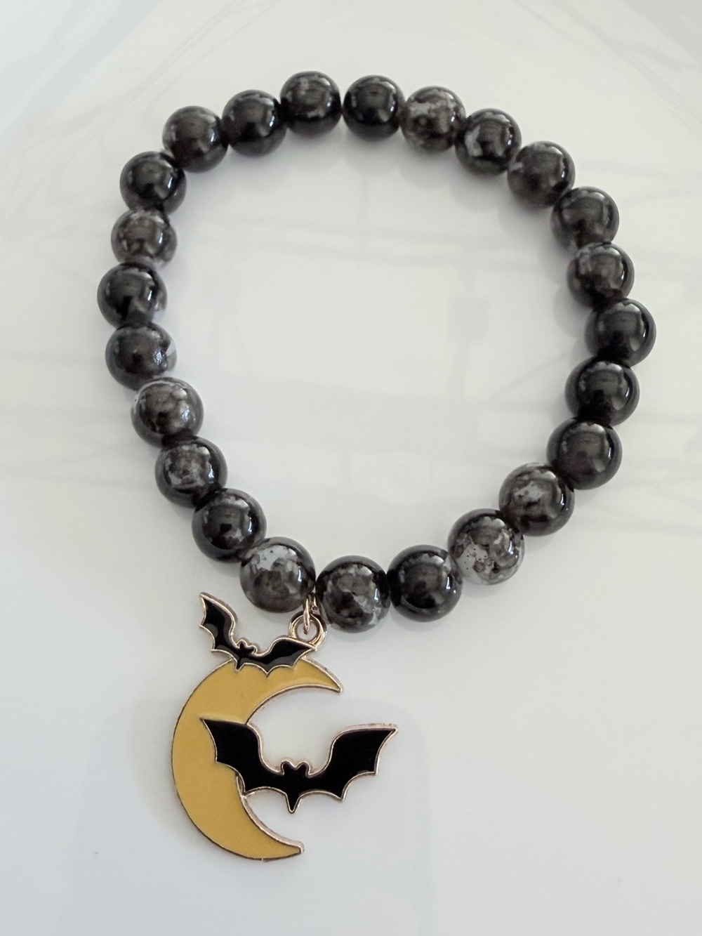 Black Beaded Bracelet with Moon & Bat Charm